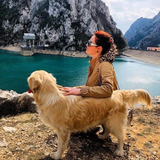 Woman and dog at a lake